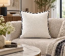 Elegant Navy-Trimmed Pillow in a Cozy Living Room.webp